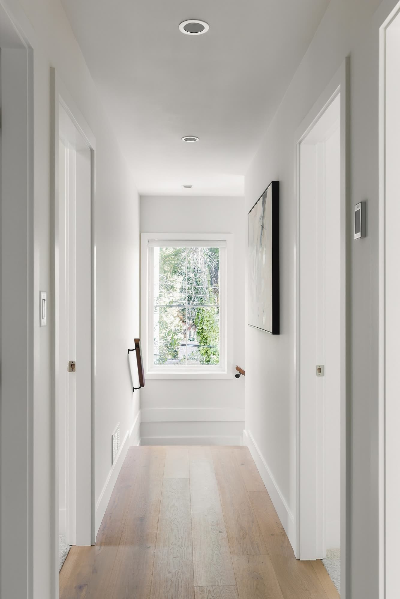 A hall with a window at the end