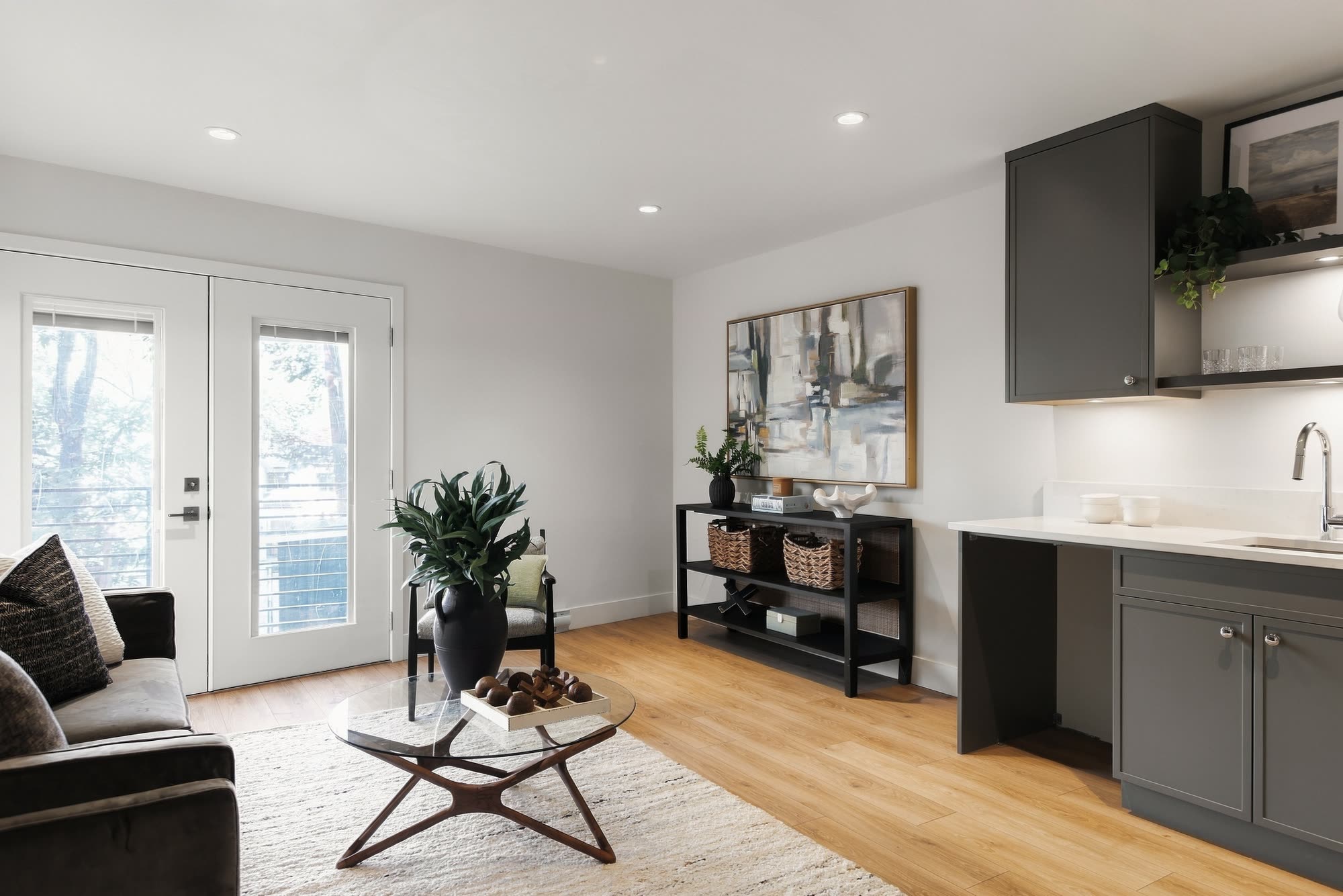 The family room, with French doors and the wet bar along the wall