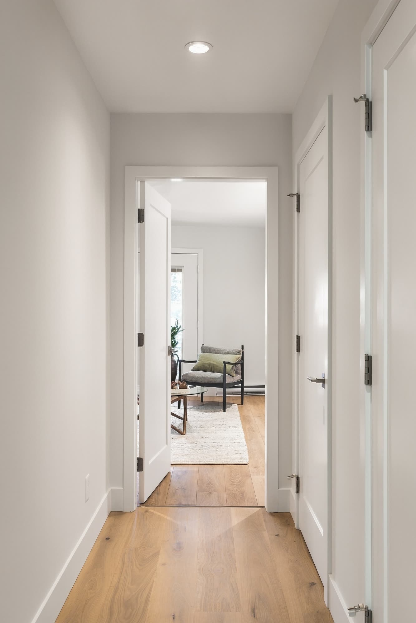A hall leading through to a bedroom