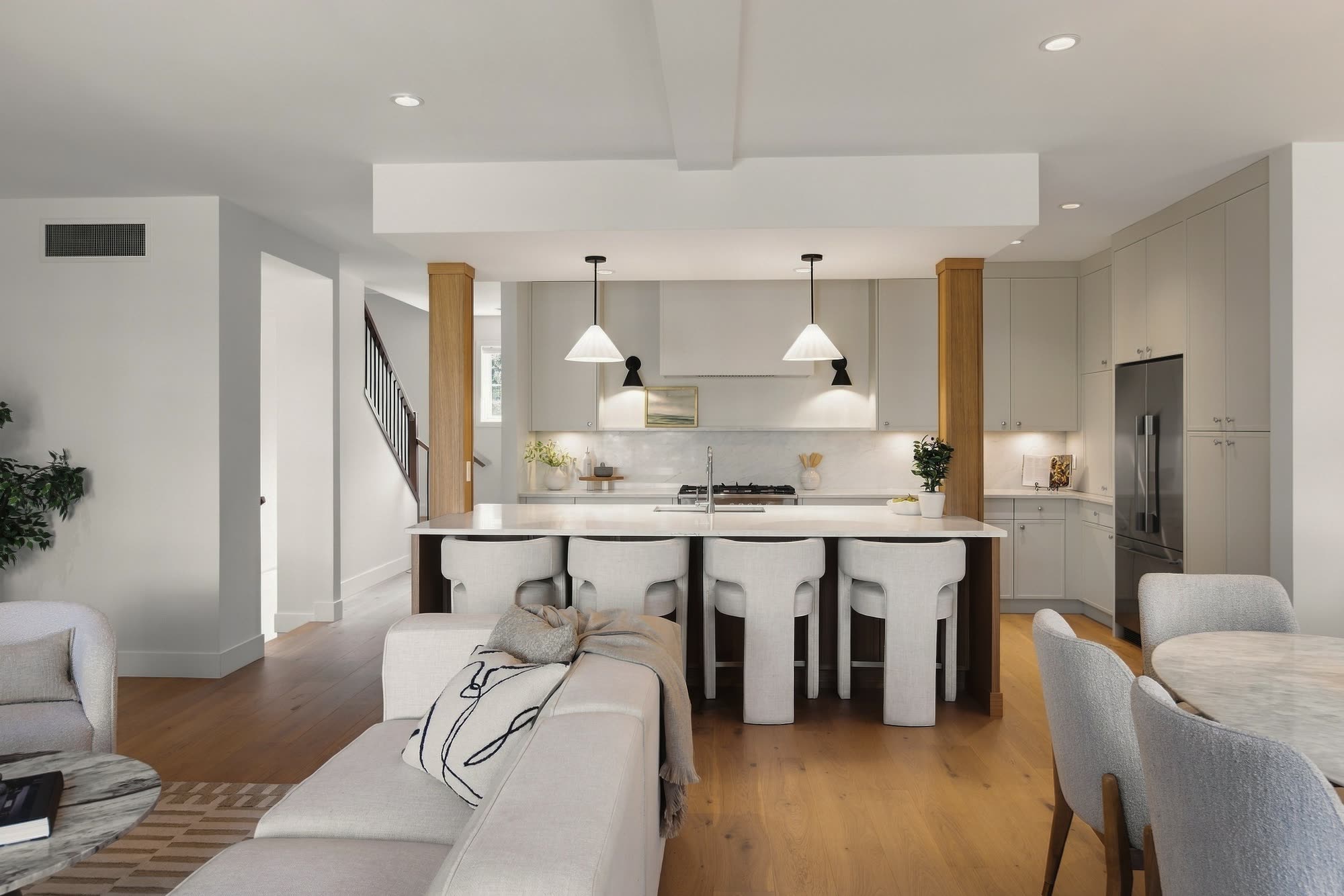 The main floor from the living room to the kitchen island and pendants